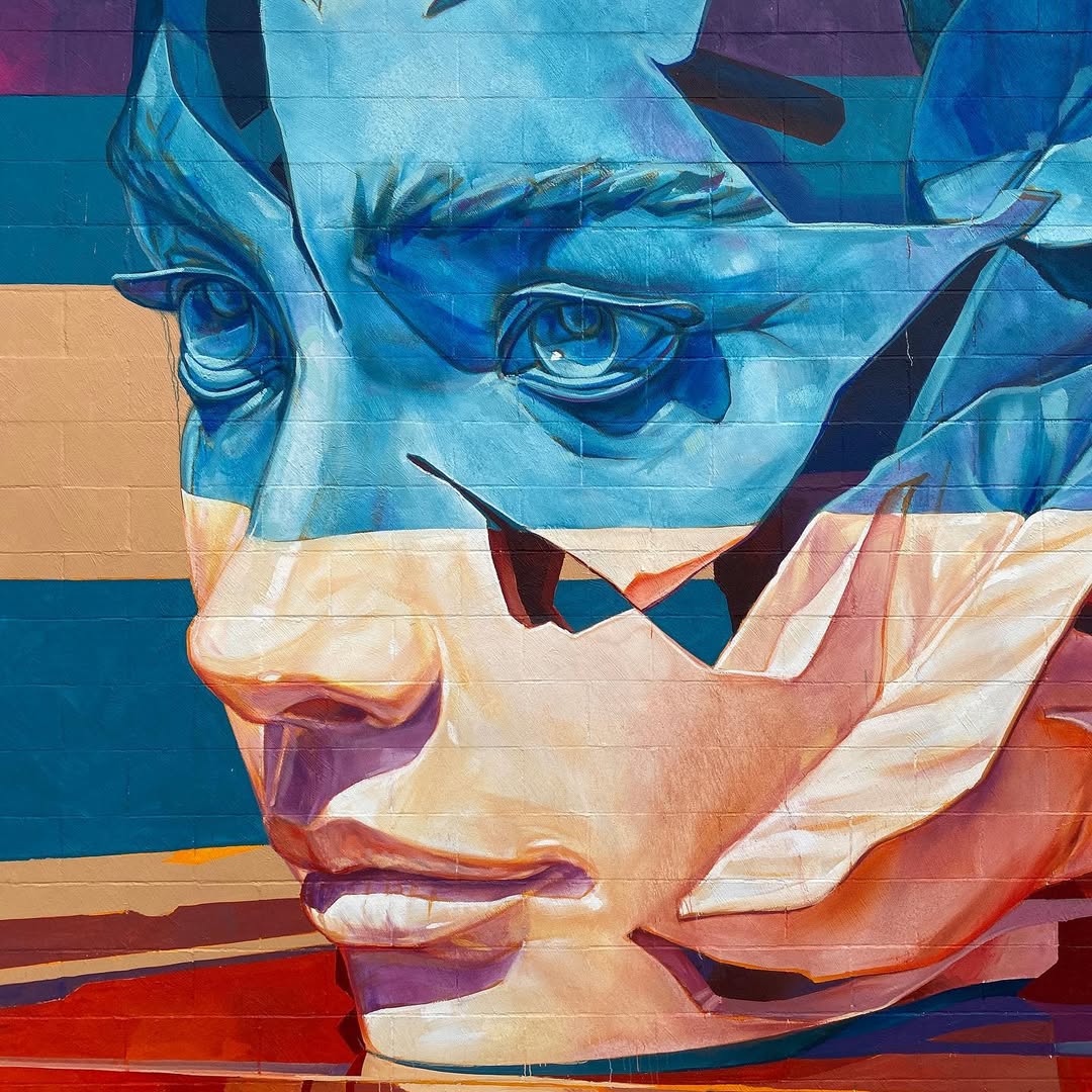 Spectacular giant mural blending nature and portraiture Towering botanical portrait mural transforming urban landscape