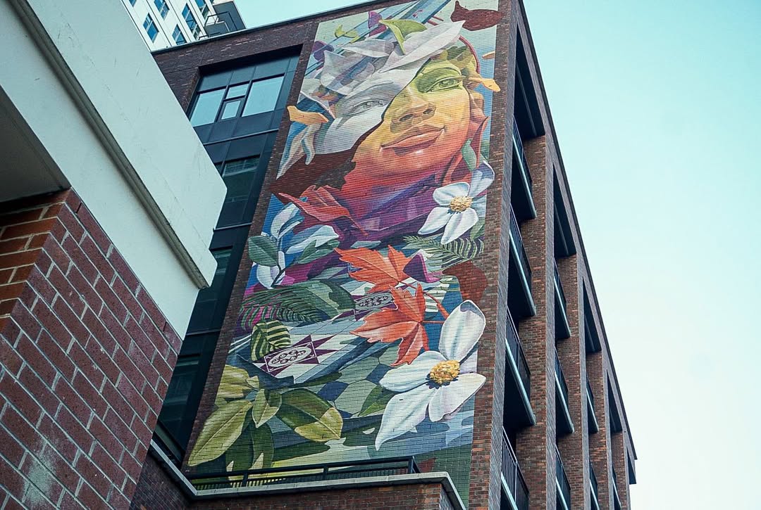 Immersive large-scale mural bringing nature to city walls Expansive street art mural featuring botanical elements