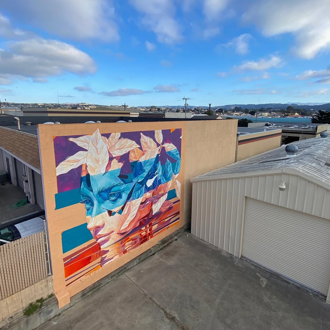 Large-scale outdoor mural with natural themes Outdoor artwork showcasing botanical elements