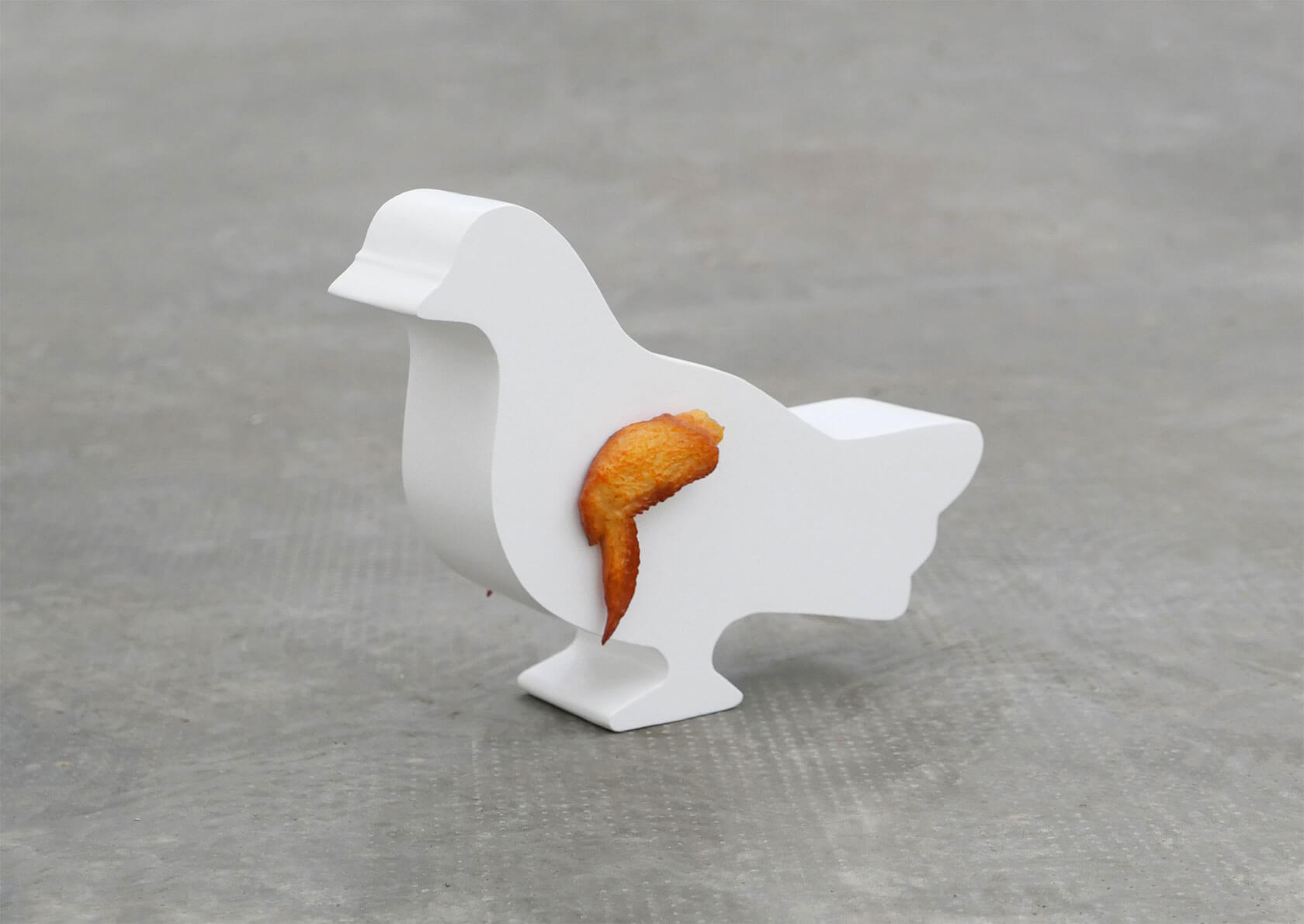 Playful pop art sculpture satirizing consumer culture with witty design elements