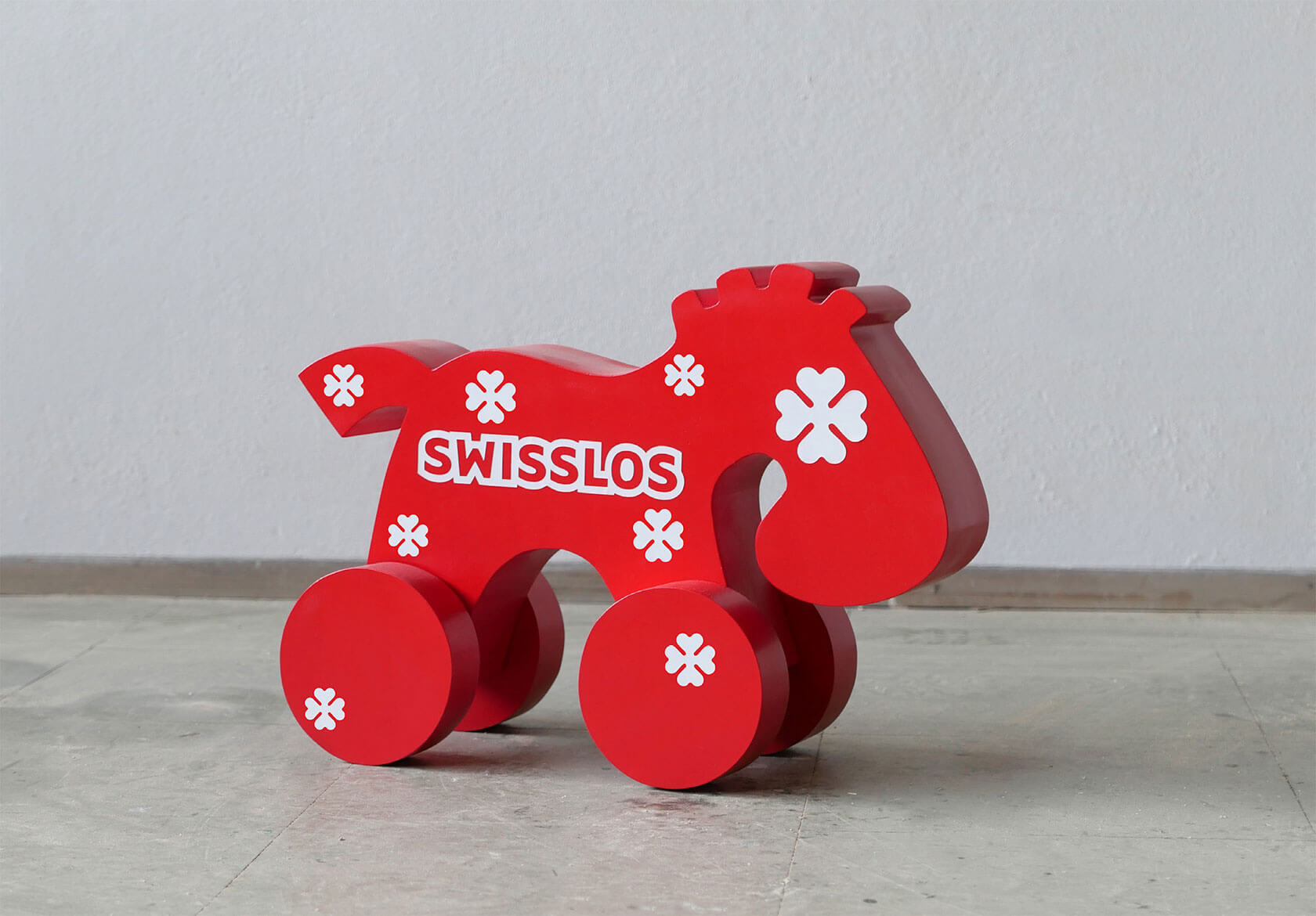 Satirical pop art sculpture critiquing consumer culture with ironic 3D design