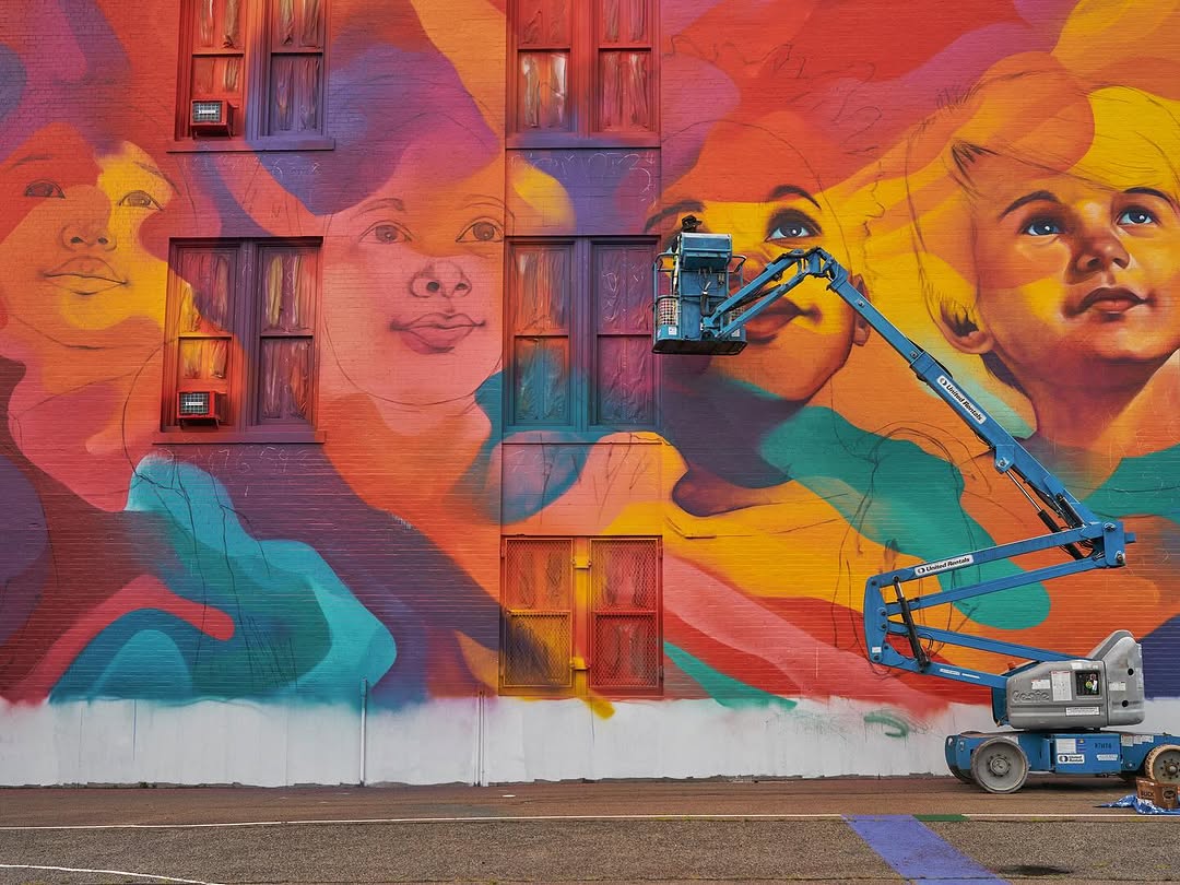 Large-scale colorful street murals with vibrant graffiti art and bold portraiture elements