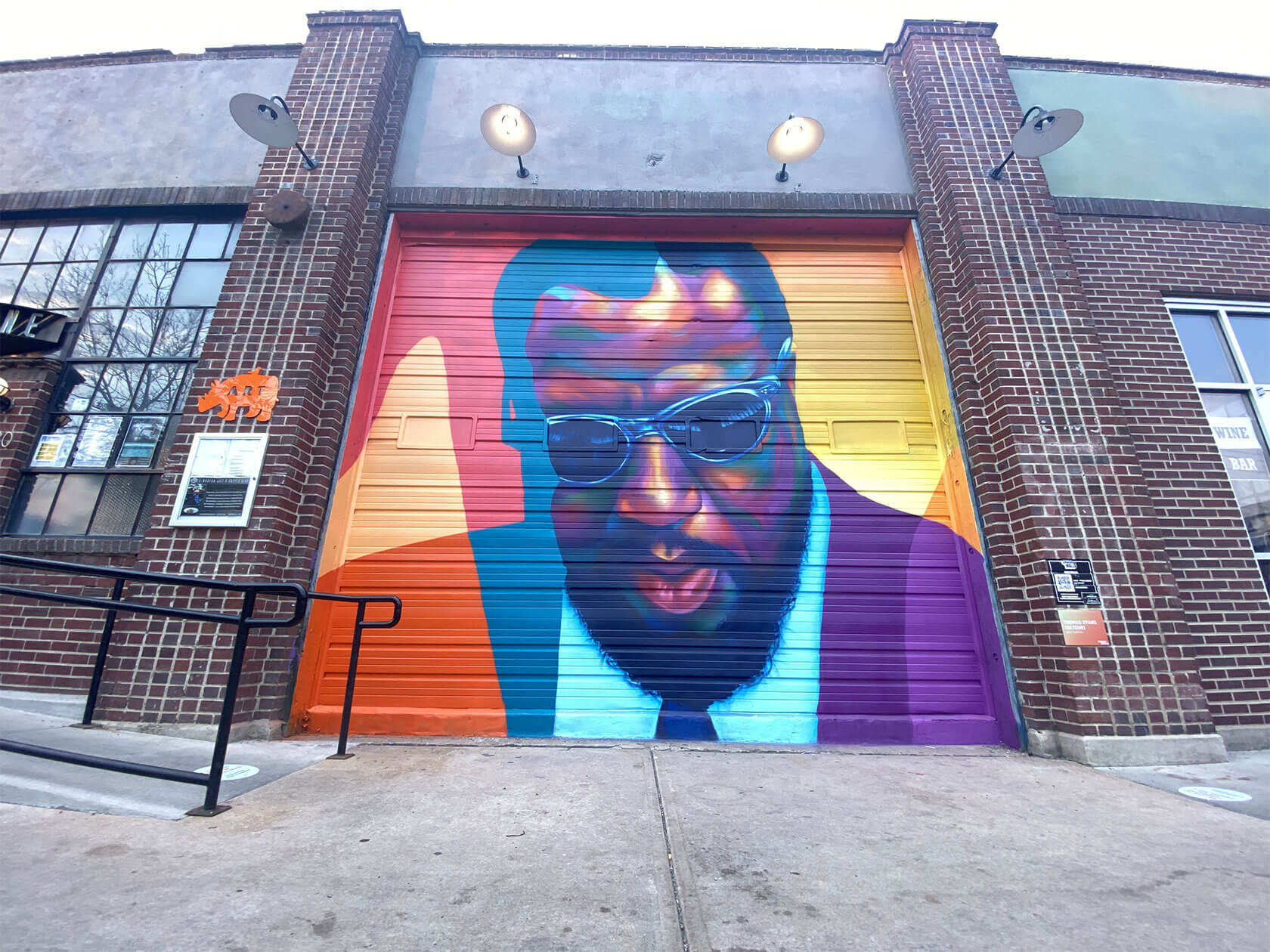 Contemporary urban wall art gallery showcasing vibrant street art murals and portraiture