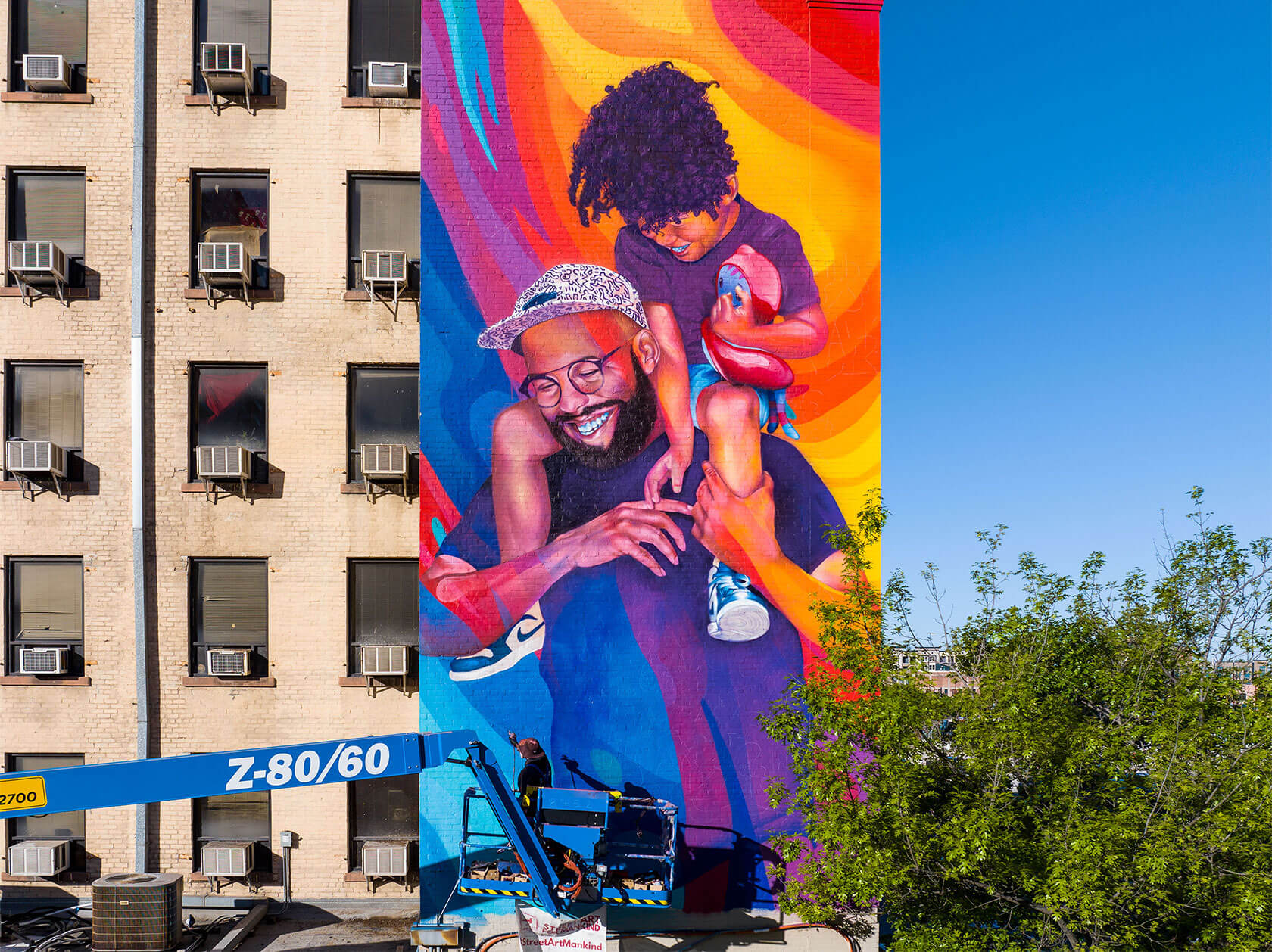 Street artist mural painting showcasing vibrant abstract and bold urban wall art