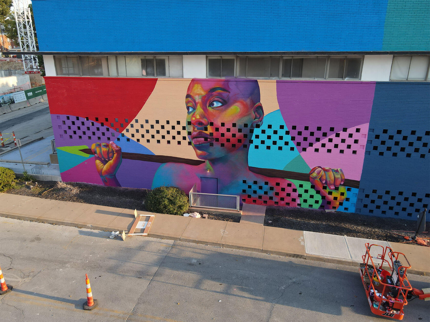 Vibrant colorful street murals showcasing bold urban wall art and striking portraiture